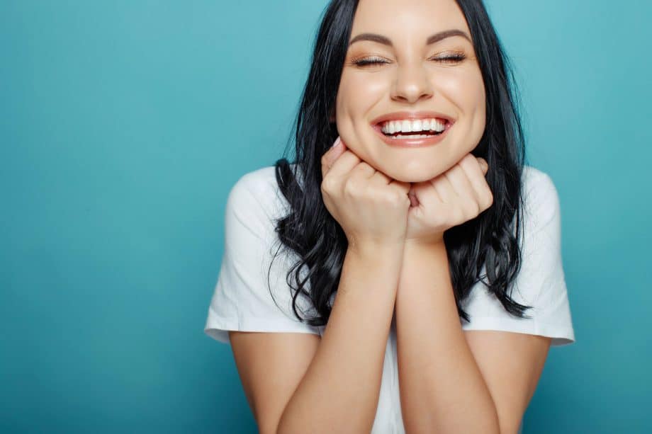 Woman excited about her smile after orthognathic Surgery in Milwaukee WI